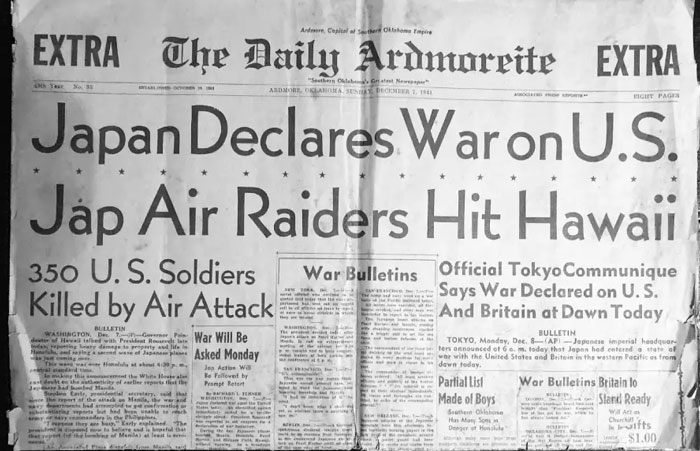 Historical newspaper headline from WWII about Japan declaring war on the U.S. and air raiders hitting Hawaii.