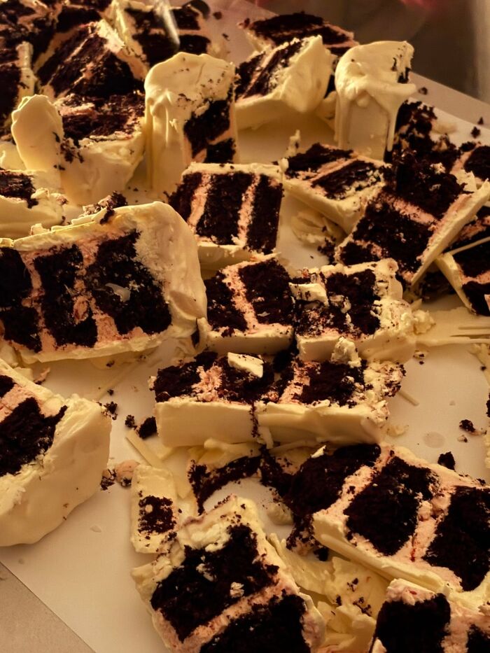 White chocolate covered cake pieces with dark cake layers