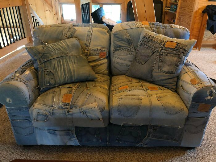 A quirky couch upholstered entirely with repurposed denim jeans, a distinctive style for an interior designer.