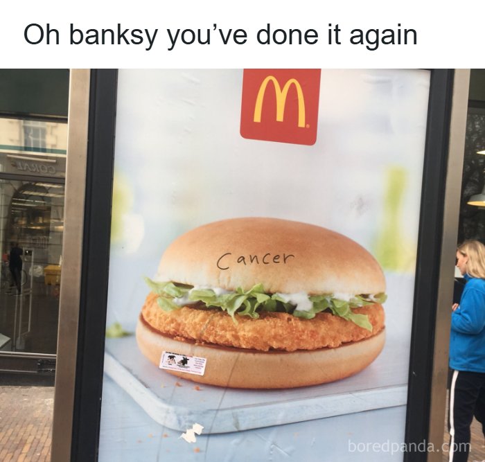 A McDonald's ad with the word Cancer written on the bun, a Banksy-esque fever dream meme.