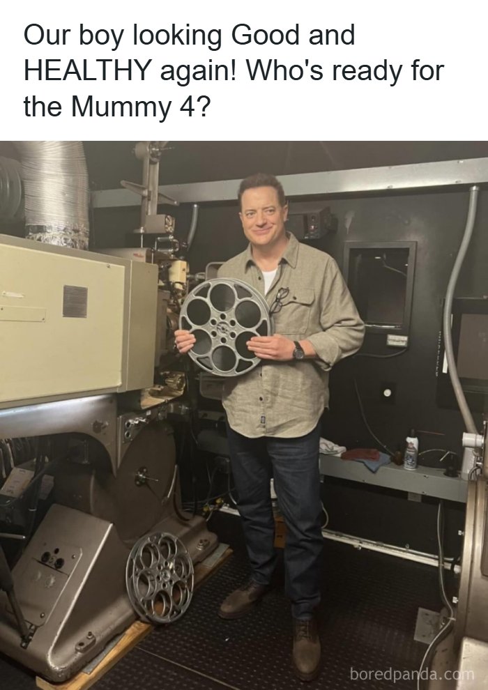 Actor holding film reel in a vintage movie projector room promoting the Mummy 4 film