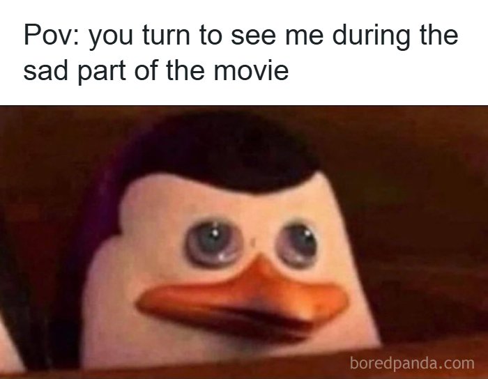 Sad penguin character from movie, turning to look during emotional scene