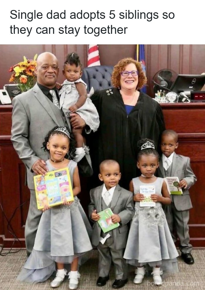 A single dad stands with five adopted siblings and a judge, celebrating their new family, a soul-healing moment.
