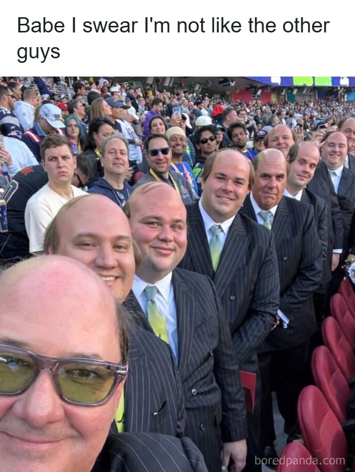 Multiple identical men in suits joke about being not like the other guys at stadium