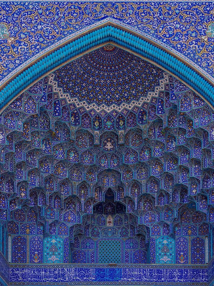 Persian Islamic architecture arch covered in detailed blue geometric and floral tilework