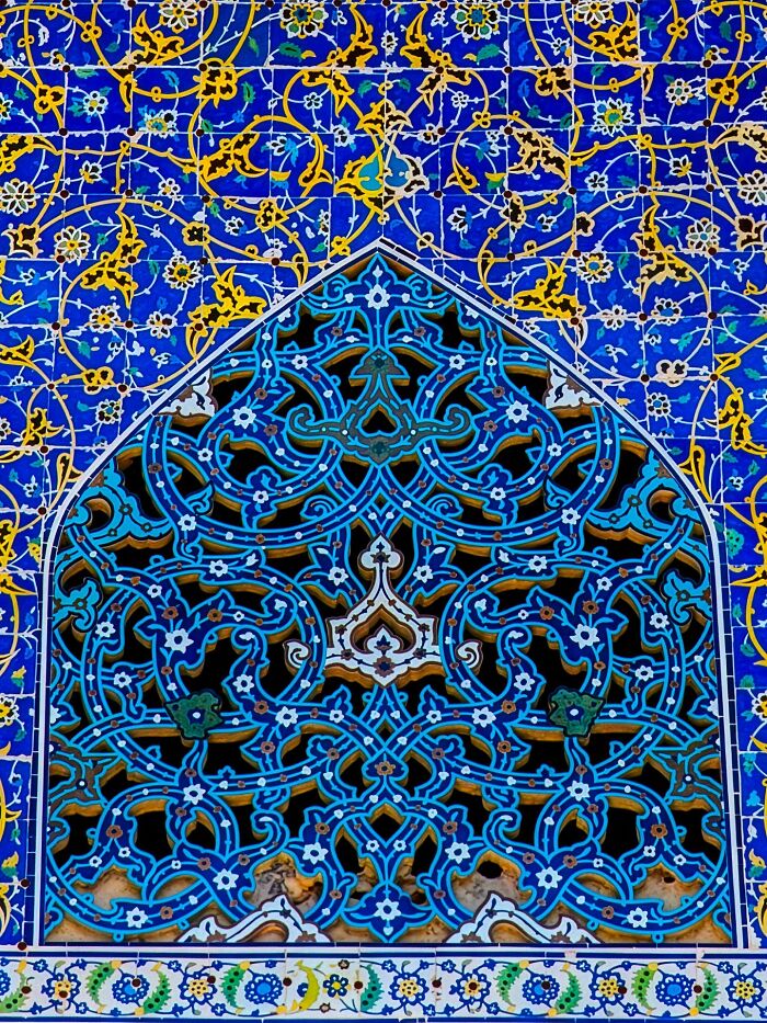 Close-up of Persian tile patterns in blue with geometric design