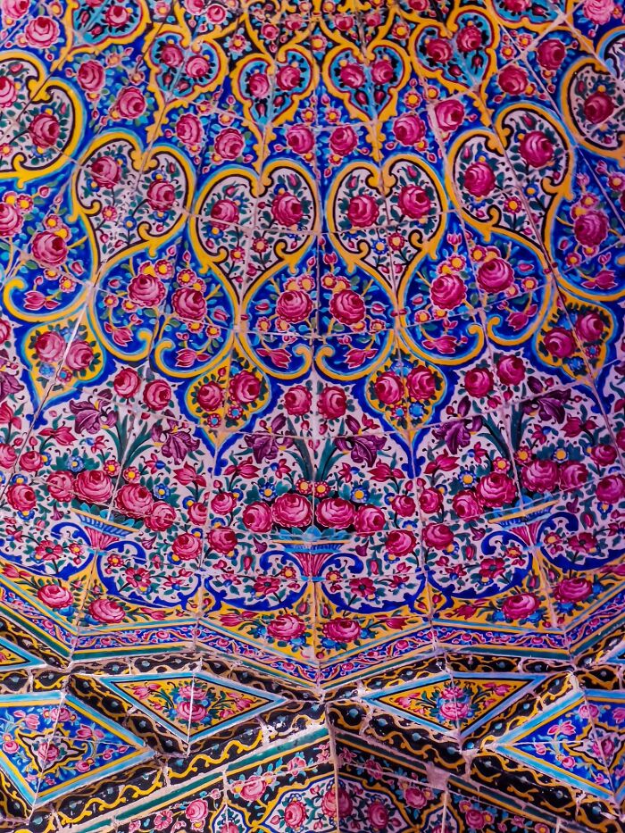 Persian floral tilework ceiling with pink and blue intricate patterns