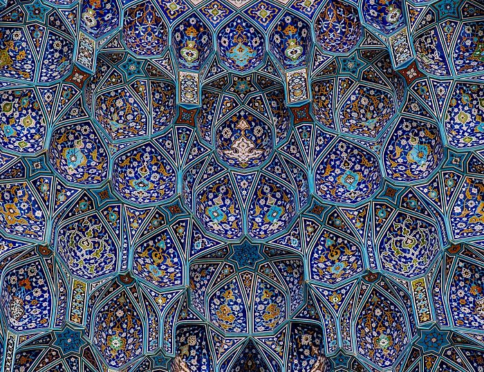 Complex Persian ceiling mosaic with blue star shapes and floral motifs