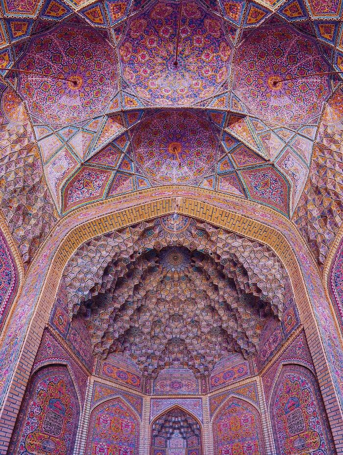 Ornate Persian archway with intricate geometric patterns and colorful tiles