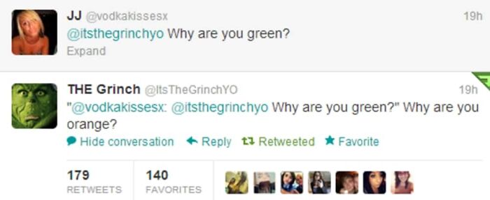 A Twitter exchange between JJ and THE Grinch, featuring a savage burn about appearance.