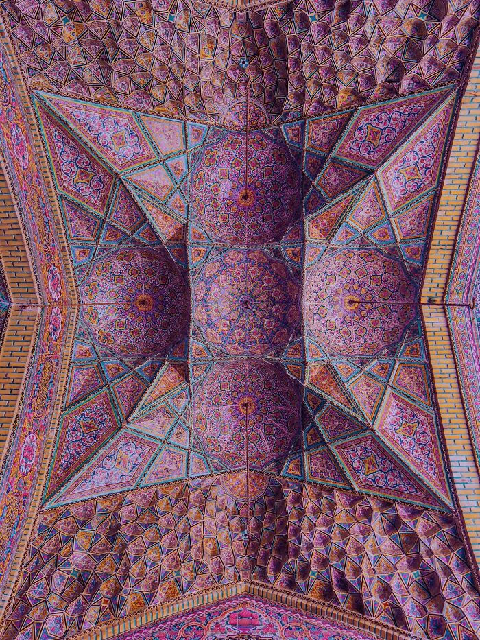 Detailed ceiling art showcasing Persian patterns and geometry in vibrant colors