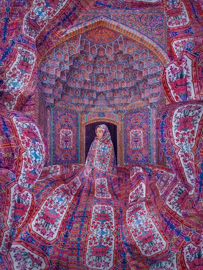 Girl blending into intricate Persian patterns and geometry in colorful traditional architecture