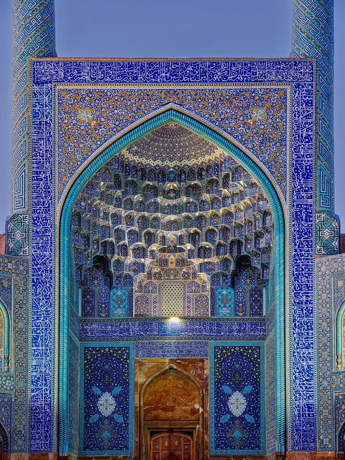Ornate entrance with Persian geometric tile patterns in blue shades