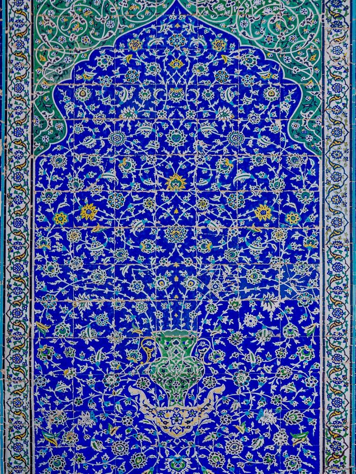 Classical Persian floral tile patterns in vivid blue and green colors