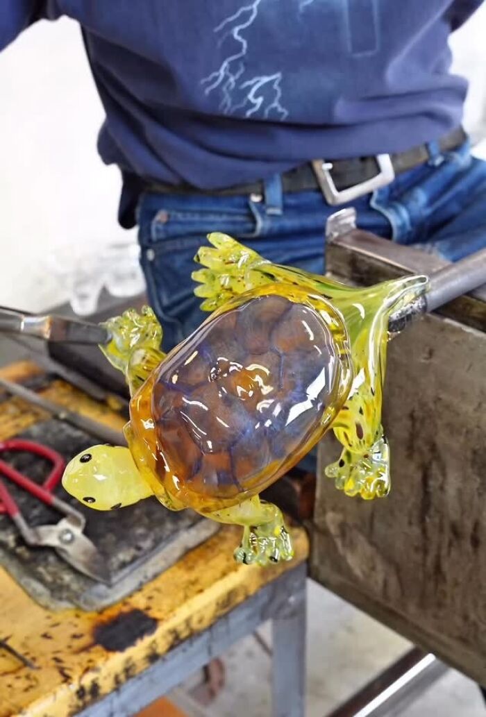 Japanese artist creates hyper-realistic glass food, crafting a detailed yellow and brown glass turtle.