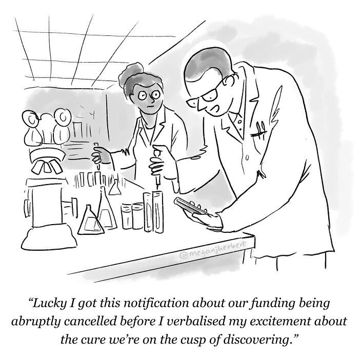 A funny comic showing two scientists in a lab, with one receiving a notification about funding being cancelled, by a multitalented cartoonist.