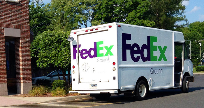 A FedEx Ground delivery truck parked, hinting at industry secrets in the logistics sector.