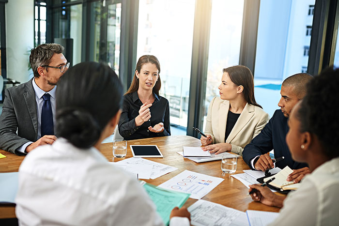 Business meeting with diverse people, revealing industry secrets customers were never meant to hear.