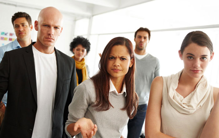 Group of family members with angry expressions at a grandma's funeral, suggesting they see dollar signs. Group of family members with angry expressions at a grandma's funeral, suggesting they see dollar signs.