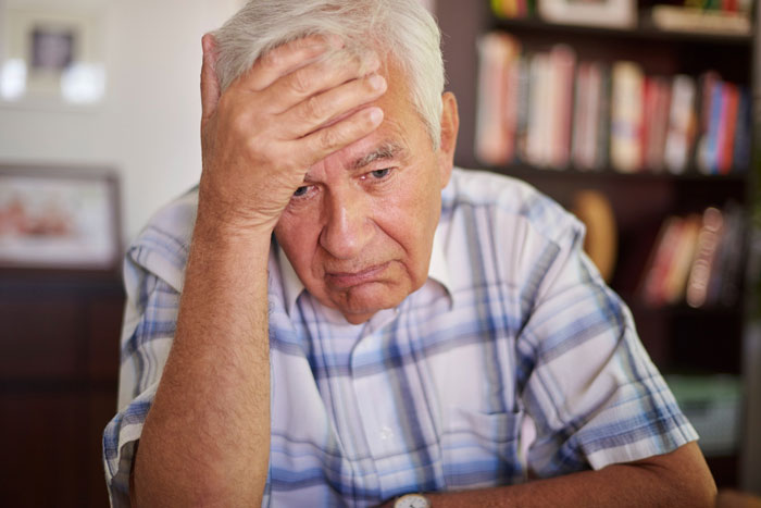 An elderly man looking distressed, possibly reflecting a relative publicly shamed at grandma's funeral. An elderly man looking distressed, possibly reflecting a relative publicly shamed at grandma's funeral.