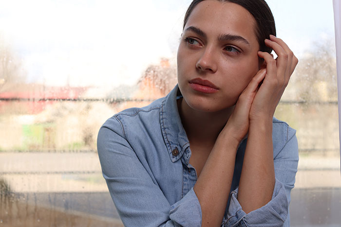 A thoughtful introverted GF at home, contemplating a bar crawl with her boyfriend and his friends for his birthday. A thoughtful introverted GF at home, contemplating a bar crawl with her boyfriend and his friends for his birthday.