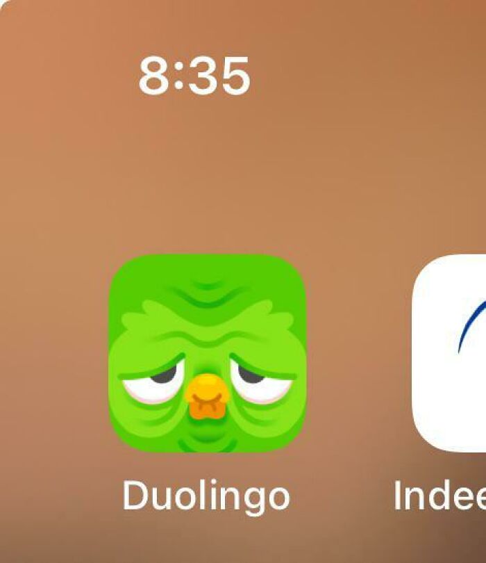 Tired Duolingo app icon on a smartphone screen at 8:35