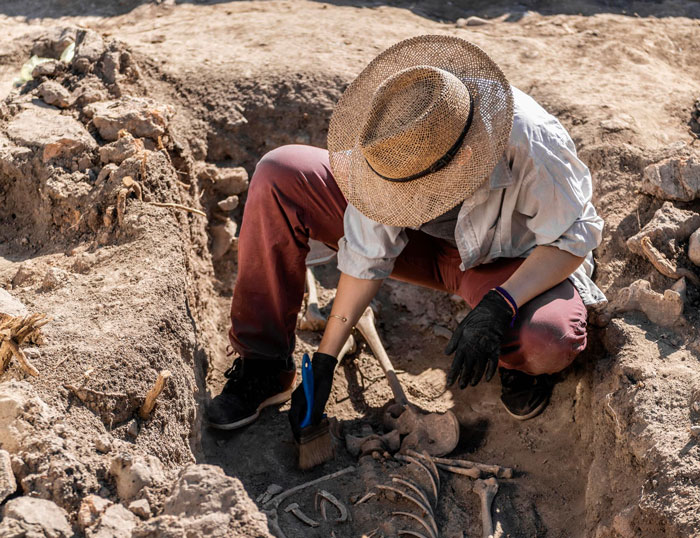An archaeologist unearths a skeleton, searching for historical evidence related to ancient Roman writings about Jesus. An archaeologist unearths a skeleton, searching for historical evidence related to ancient Roman writings about Jesus.