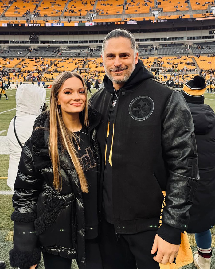 Joe Manganiello and a woman at a football stadium, reflecting on his mystery illness and brutal side effects.