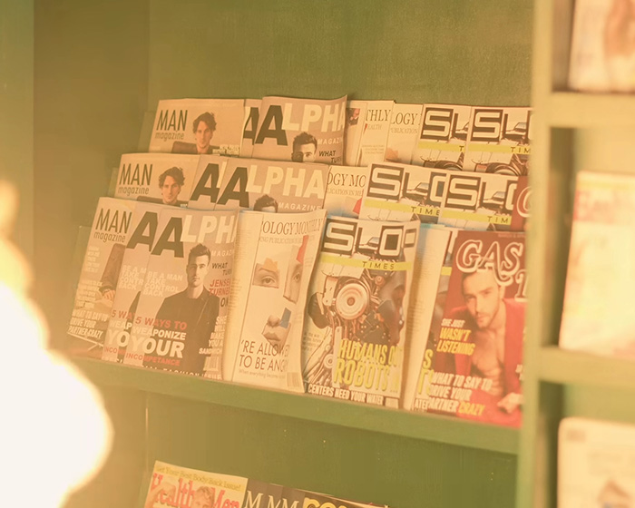 Magazines on a shelf, one showing Orlando Bloom, part of the horrifying new video.