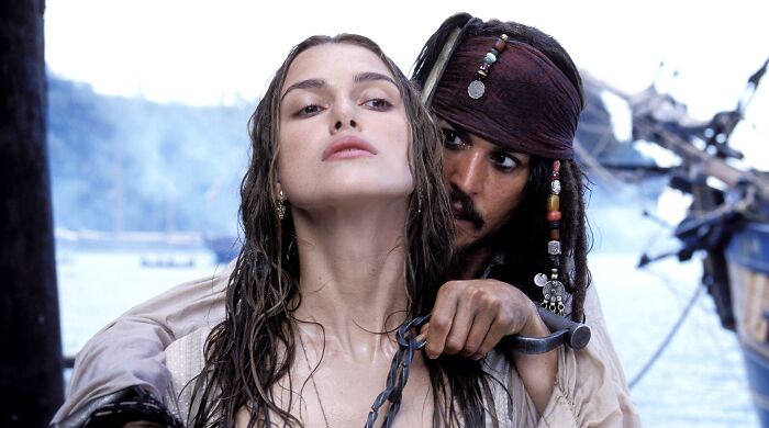 Keira Knightley as Elizabeth Swann and Johnny Depp as Captain Jack Sparrow in Pirates of the Caribbean. Keira Knightley as Elizabeth Swann and Johnny Depp as Captain Jack Sparrow in Pirates of the Caribbean.