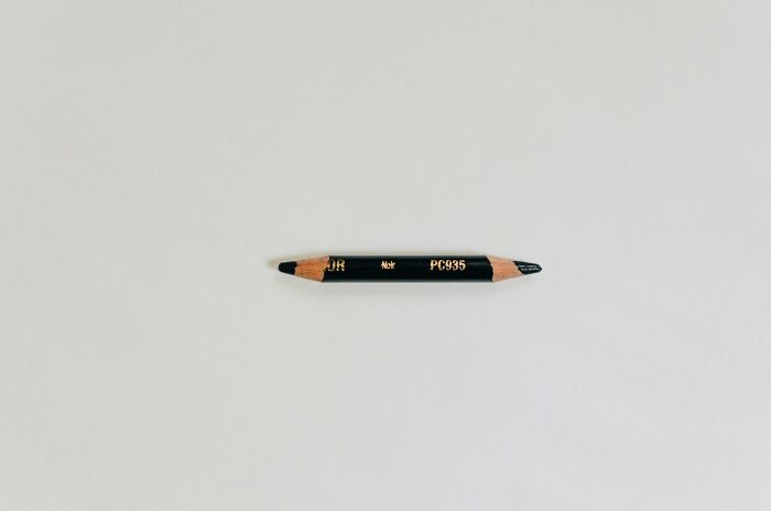 A short, double-ended black pencil, a silly solution for maximizing utility.
