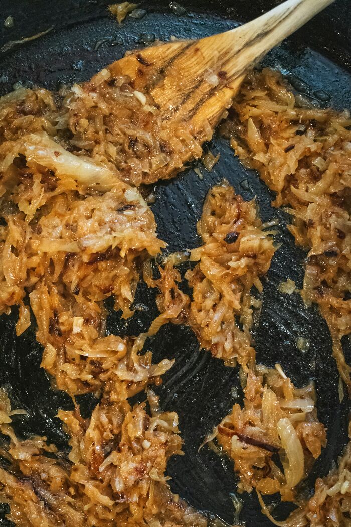 Caramelized onions cooking in pan close-up food facts