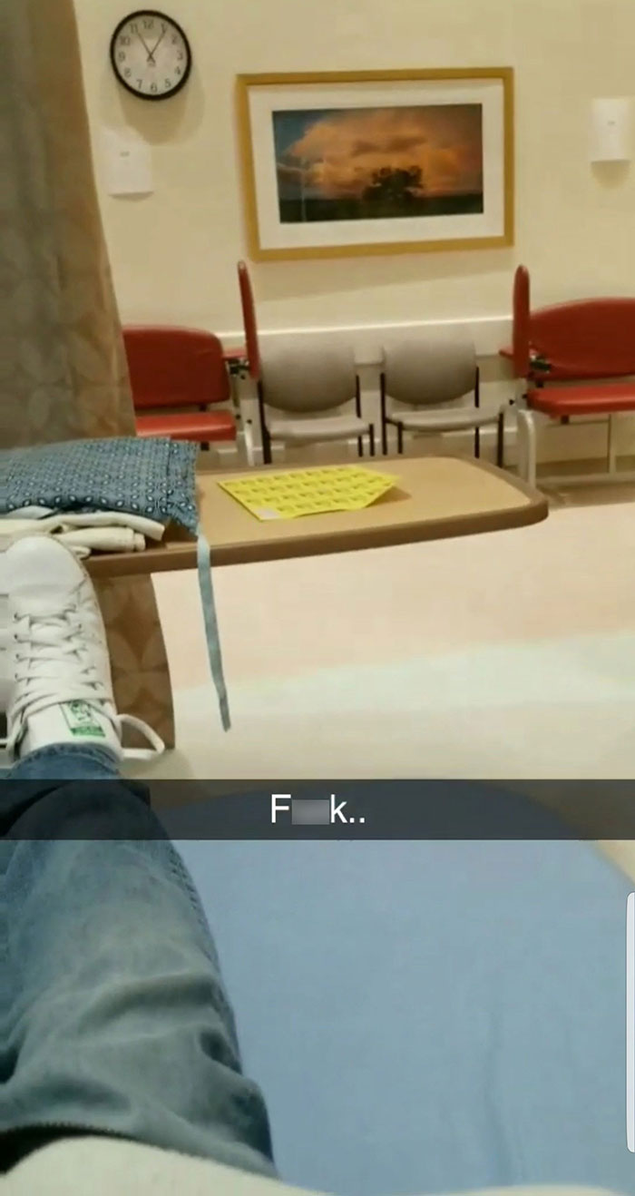 A person's legs visible in what appears to be an emergency room after a lie allergy incident at a restaurant.