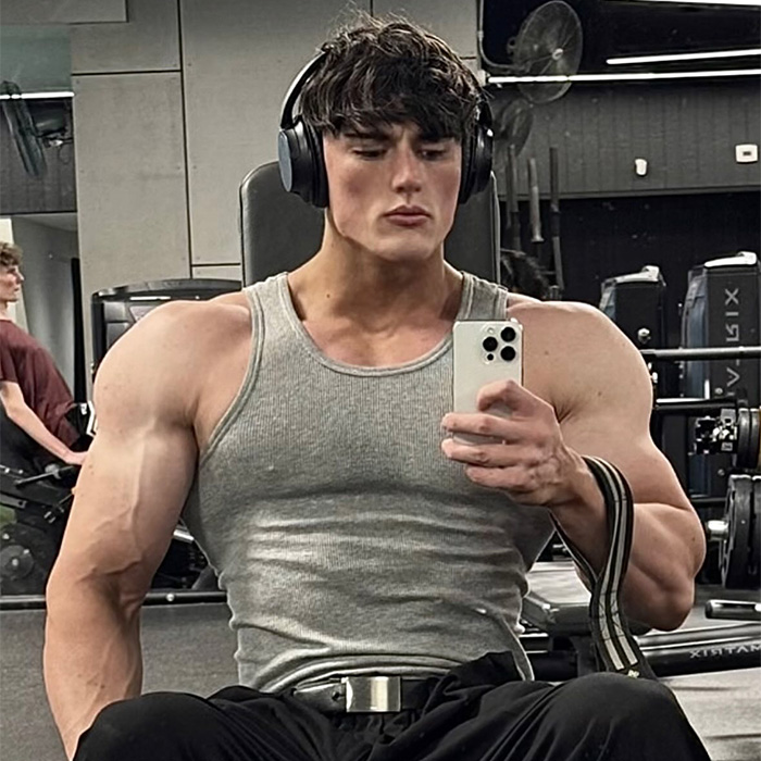 Looksmaxxer Androgenic taking a selfie in a gym, showing his muscular physique. Looksmaxxer Androgenic taking a selfie in a gym, showing his muscular physique.