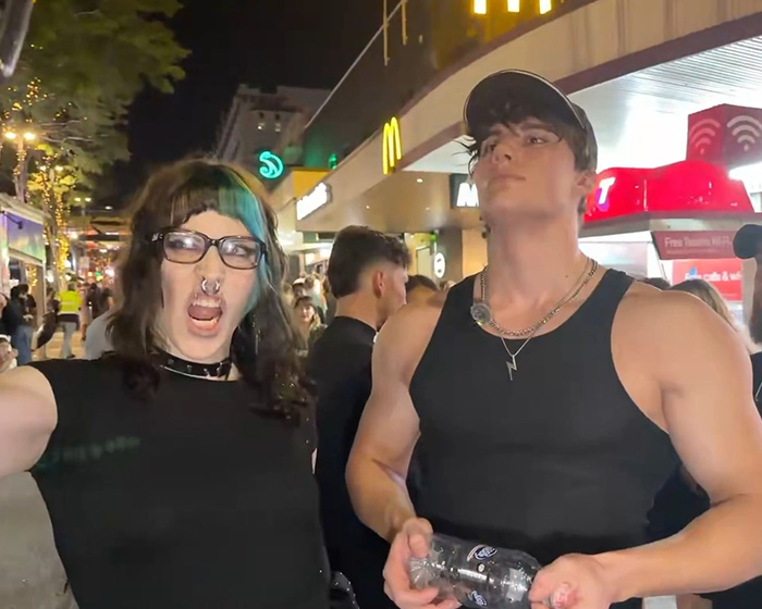 Looksmaxxer Androgenic with a trans woman in an urban street, capturing their surprising interaction. Looksmaxxer Androgenic with a trans woman in an urban street, capturing their surprising interaction.