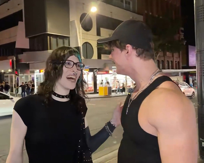 Looksmaxxer Androgenic talking to a trans woman on a city street, appearing engaged in conversation. Looksmaxxer Androgenic talking to a trans woman on a city street, appearing engaged in conversation.