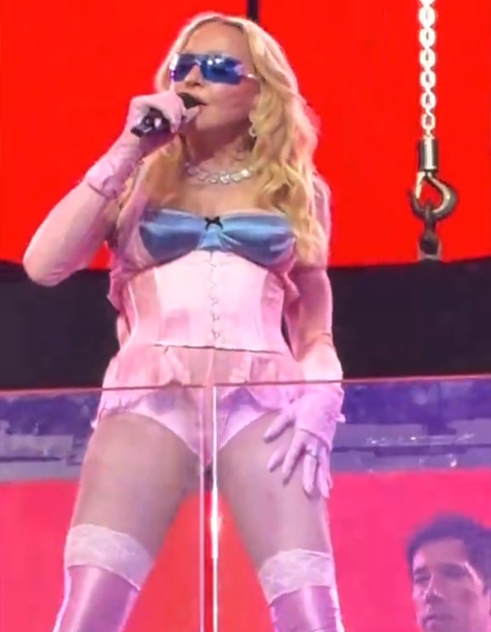 Madonna's performance in Times Square, in a pink corset and blue glasses, sparks hilarious reactions.