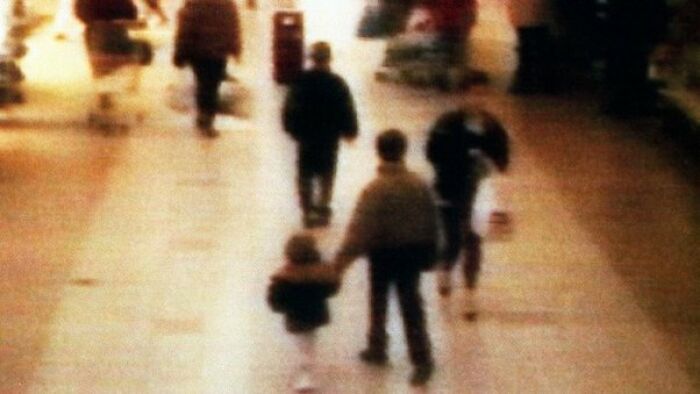Creepy photo of two people with spiky hair resembling eerie halos