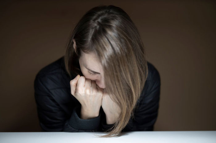 A sad ex-wife after a husband's accident, reflecting on the marriage ending but refusing to leave his side.