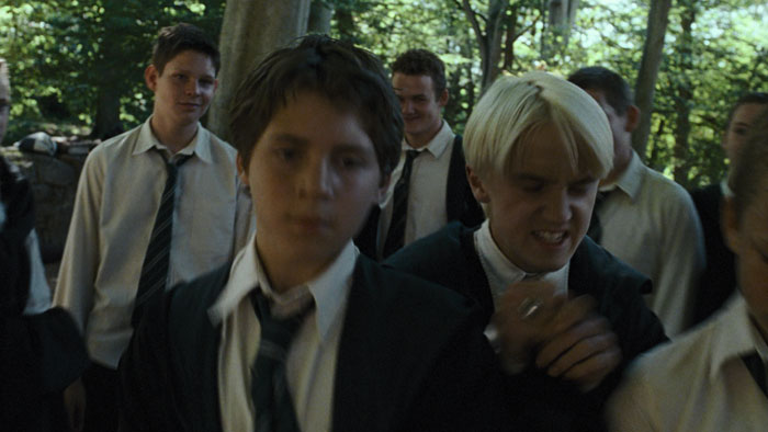 A scene from the 3rd Harry Potter movie, featuring a young man with blonde hair among other students. A scene from the 3rd Harry Potter movie, featuring a young man with blonde hair among other students.