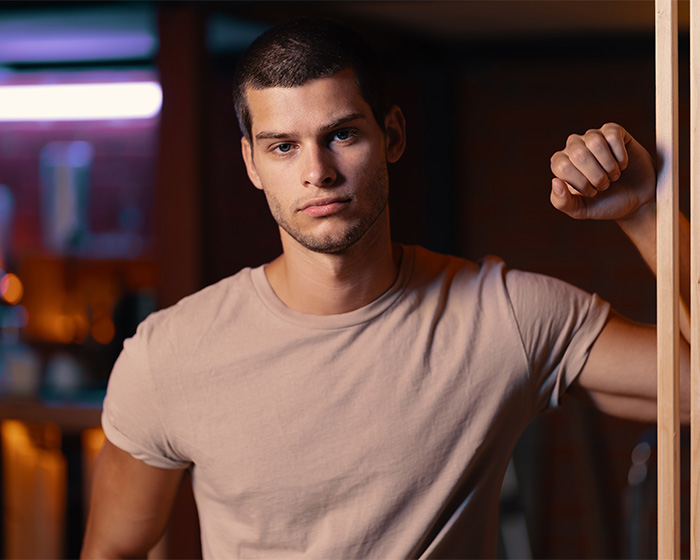 Young man looking serious contrasting female attractiveness Young man looking serious contrasting female attractiveness