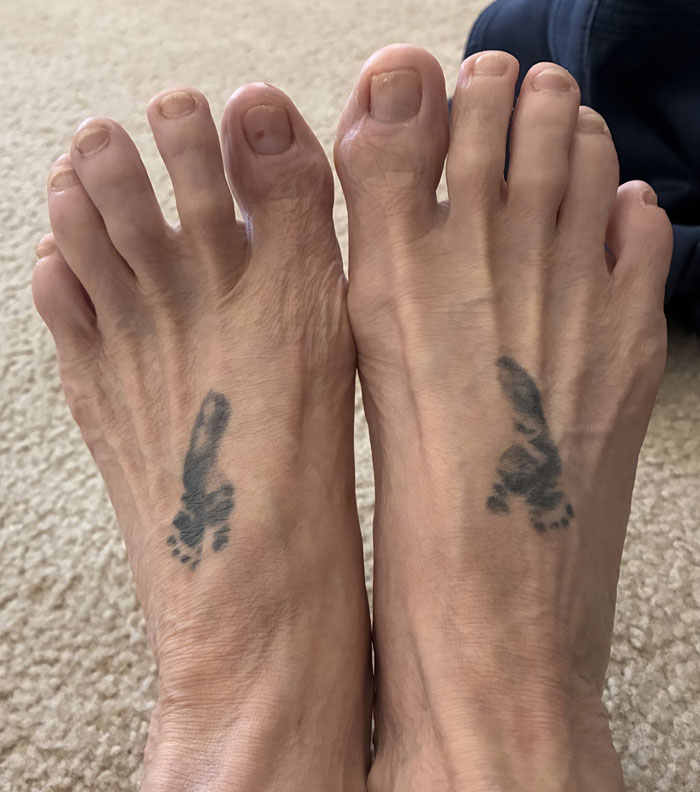 Feet with baby footprint tattoos, highlighting tattoos that mean more than what meets the eye.