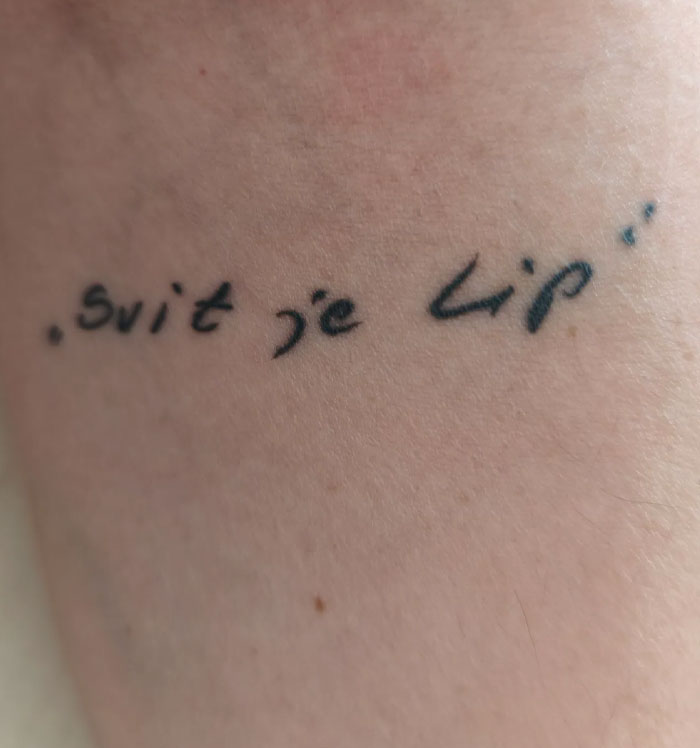 Close-up of a meaningful quote tattoo on a person's arm, showcasing unique tattoos with significant meanings.