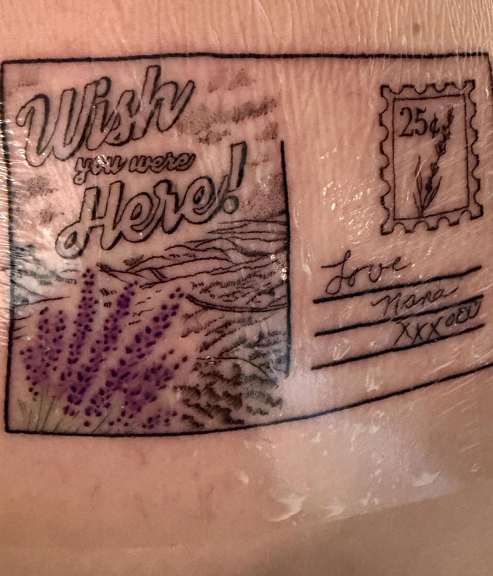 A unique postcard design tattoo with lavenders and the words Wish you were Here!