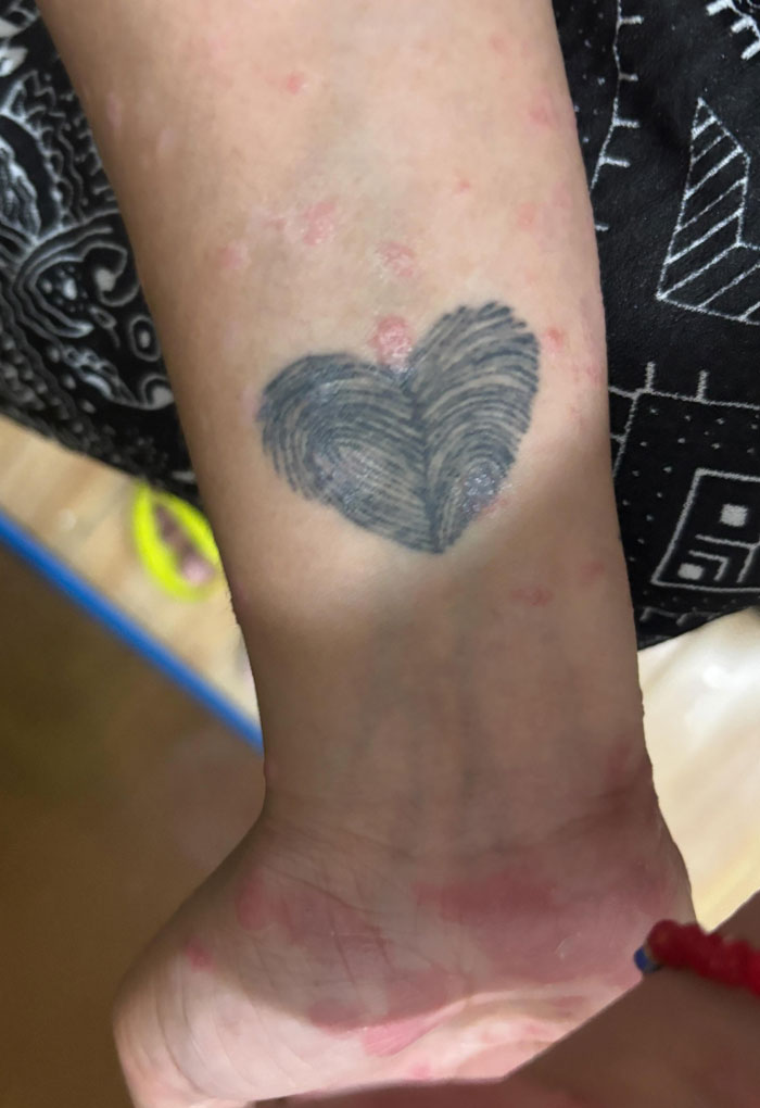 A unique heart-shaped fingerprint tattoo on a wrist, symbolizing profound and meaningful tattoos.