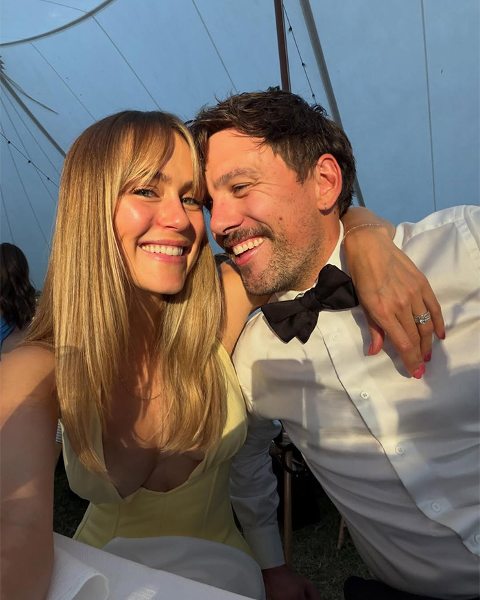 Media personality and a man smiling together, making a bedroom confession that women agree with.