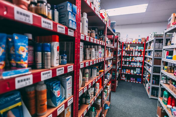 Shelves filled with various products in a store, suggesting a facade or a front for hidden true selves.
