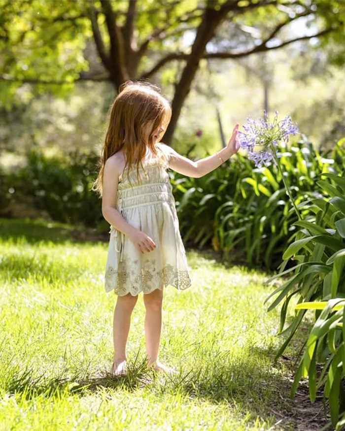 Lilibet playing barefoot in garden on her 5th birthday