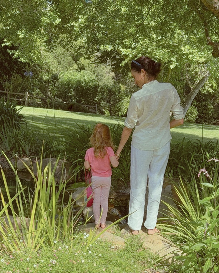 Meghan Markle holding hands with child in garden, concern about kids
