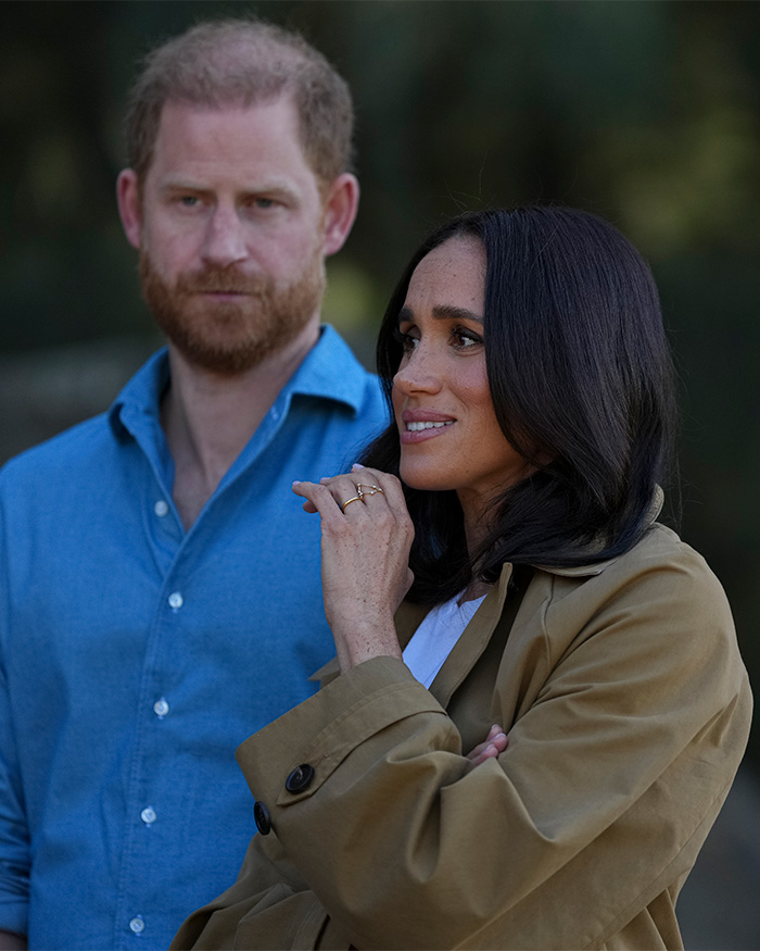 Prince Harry and Meghan Markle together outdoors with thoughtful expressions Meghan Markle kids
